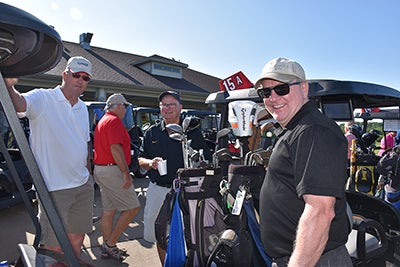 Golfers at annual charity golf event
